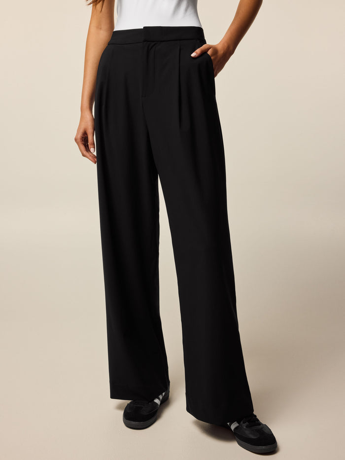 Black Greyson Phoenix Wide Leg Pleated Trouser - Front View Cropped, Mid-Rise Waistband On Model