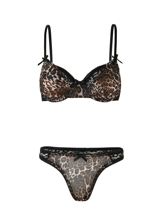 The ALANIS SET - NEUTRAL : LEOPARD by TIGERMIST is a stunning leopard print lingerie set that includes a bra and panties. The adjustable bra features thin black straps adorned with small black bows where the straps meet the cups. The matching panties are made from high-stretch fabric, embellished with black lace trim, and finished with a small black bow at the center of the waistband.
