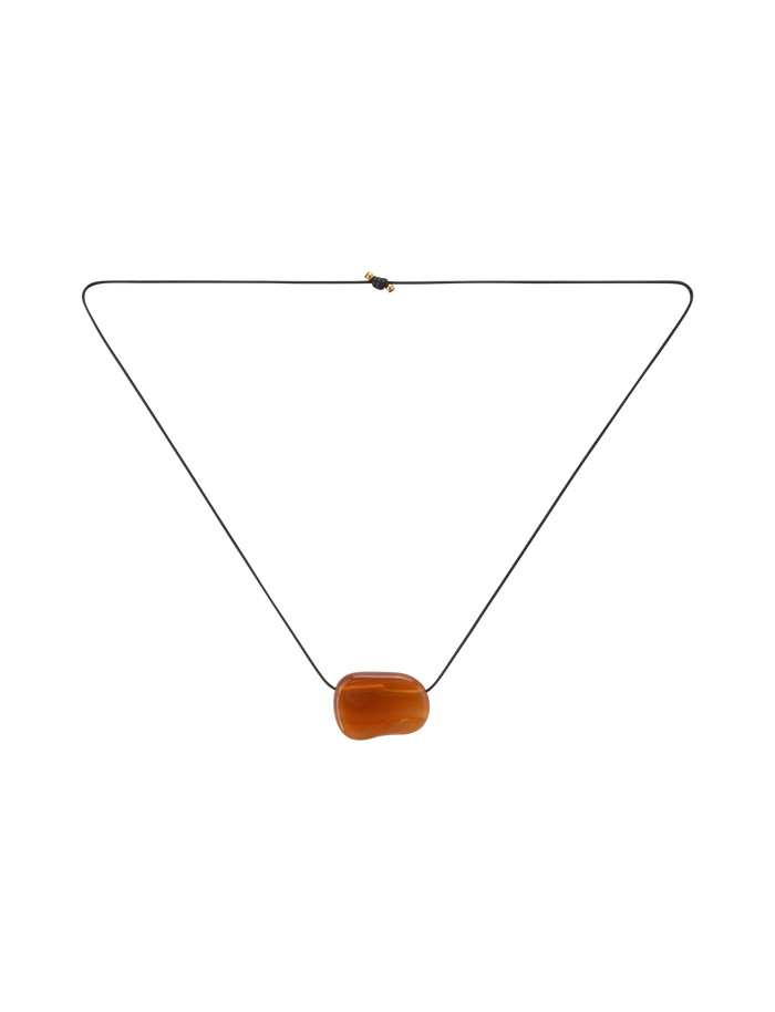 The ALILAH NECKLACE - AMBER by TIGERMIST is a minimalist black cord necklace with a single smooth amber pendant, designed to be adjustable for the perfect fit.