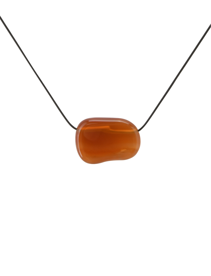 The TIGERMIST ALILAH NECKLACE - AMBER features a smooth oval amber pendant on a thin black cord, shown against a plain white background.