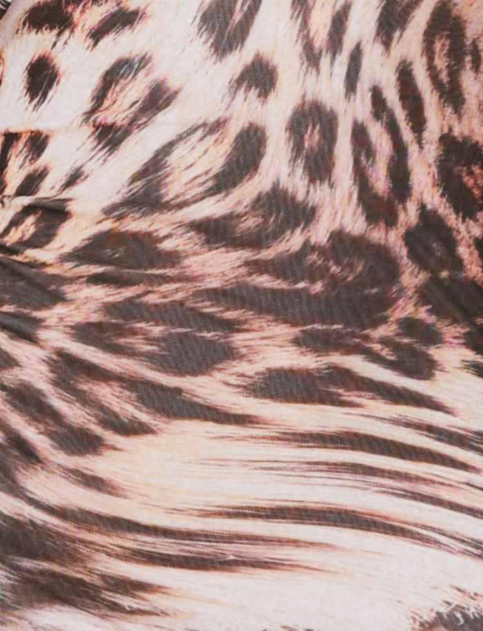 Close-up of the TIGERMIST ALLIRA MESH MINI DRESS 2.0 - NEUTRAL : LEOPARD : LEOPARD HAZE, showing brown, black, and beige animal print spots and stripes reminiscent of leopard fur.
