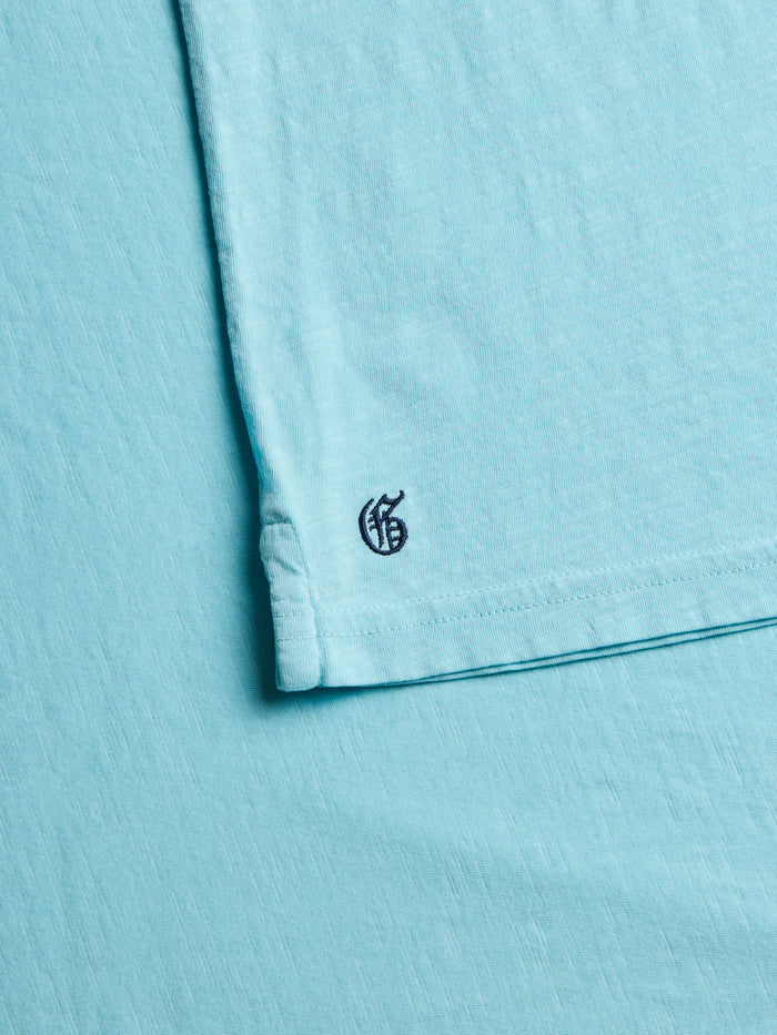 Maltese Blue Alpha Polo - Tonal Gothic G Hem Embroidery Detail | Greyson Clothiers