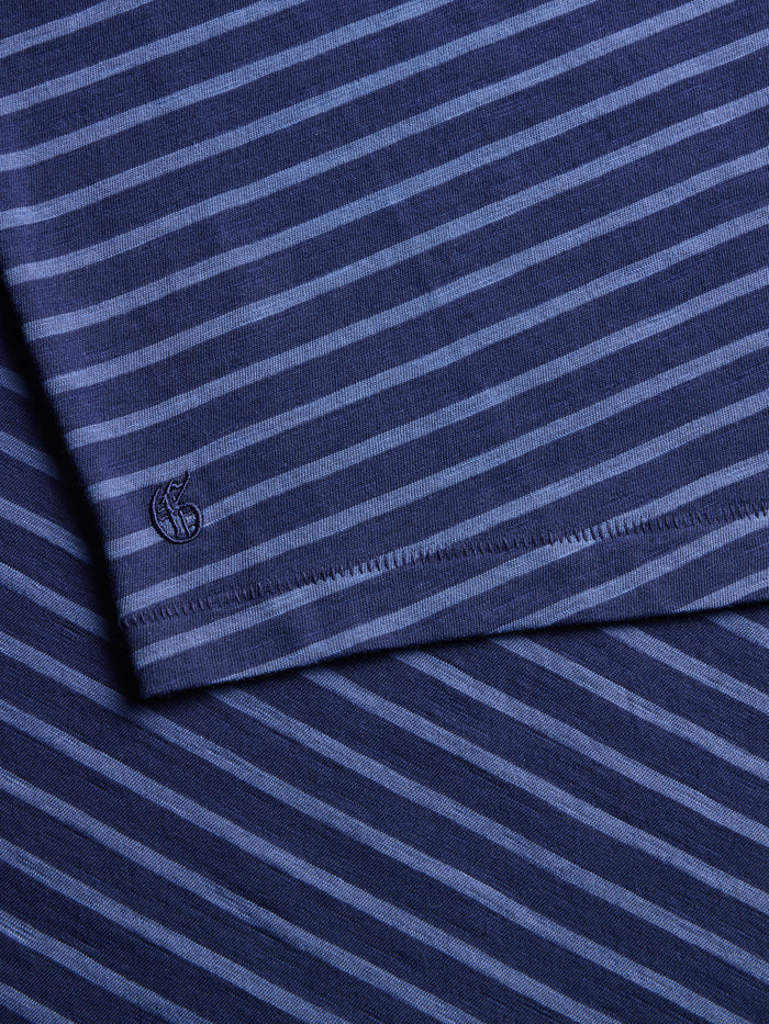 Maltese Blue Alpha Slub Striped Tee - Embroidered Logo Hem Detail Close-Up | Greyson Clothiers