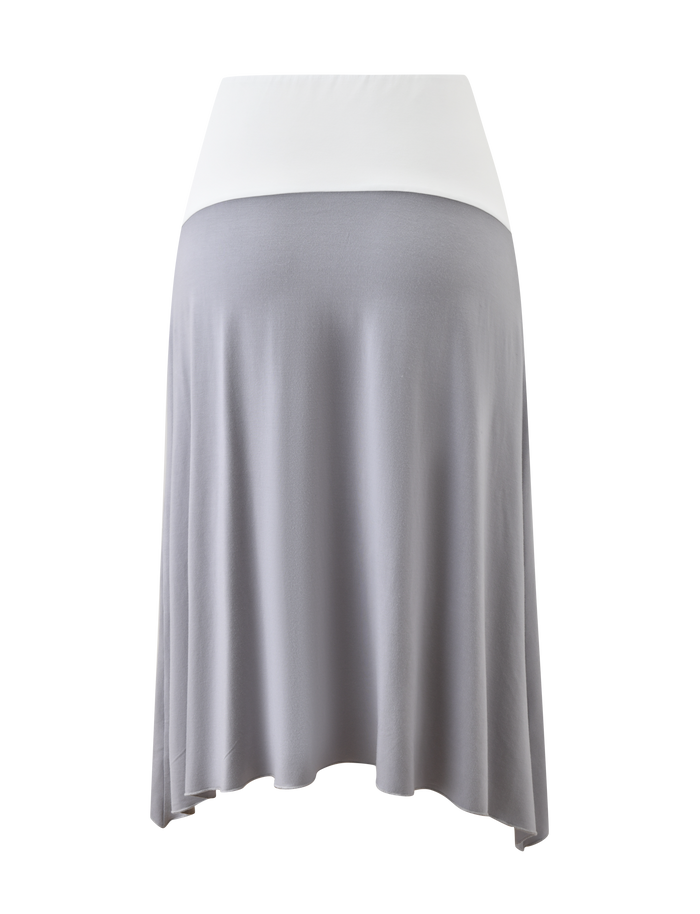 The TIGERMIST ALYSSA HI LO SKIRT - GREY is a knee-length maternity midi with a white fold-over waistband, light gray fabric, and a stylish front leg slit for comfort and flair.