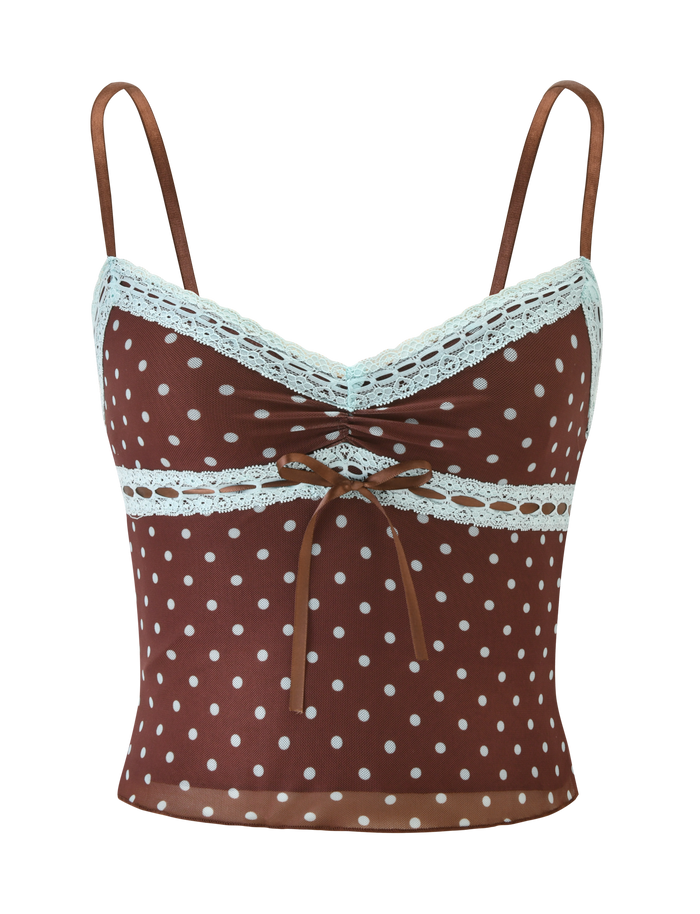 The AMARA TOP - POLKA DOT by TIGERMIST is a brown cami crop top with white polka dots, thin straps, lace trim on the neckline and underbust, and a small brown bow at the front.