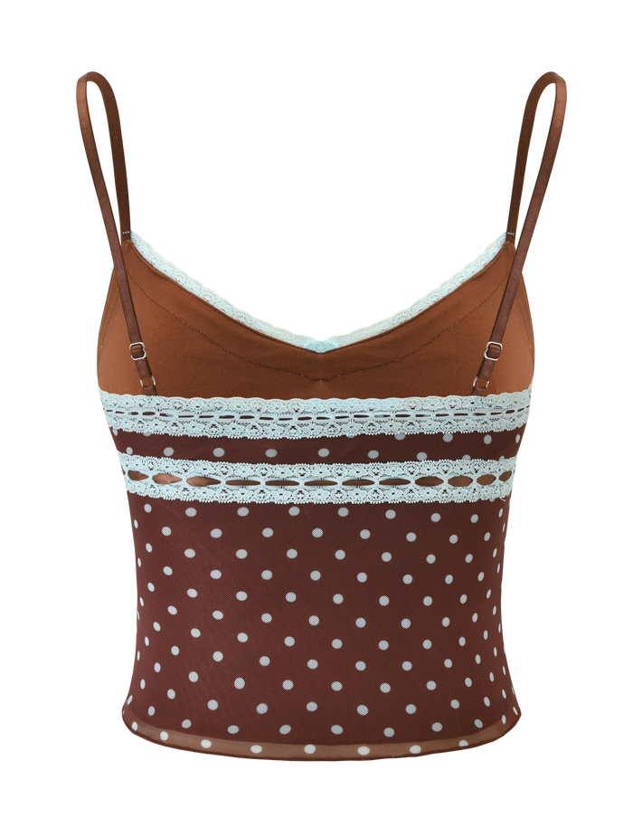 The TIGERMIST AMARA TOP - POLKA DOT features brown fabric with white polka dots, light blue lace trim on the neckline, and two matching lace bands across the chest. Background is plain white.