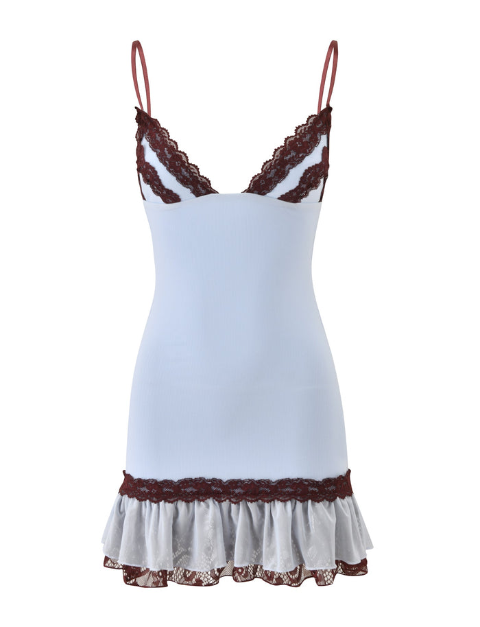 TIGERMIST’s ARIES MINI DRESS - BLUE AND BROWN is a white sleeveless slip dress featuring thin, adjustable shoulder straps, blue and brown lace trim on the neckline and hem, and a ruffled skirt at the bottom. This fitted mini dress effortlessly combines delicate details with a flattering silhouette.