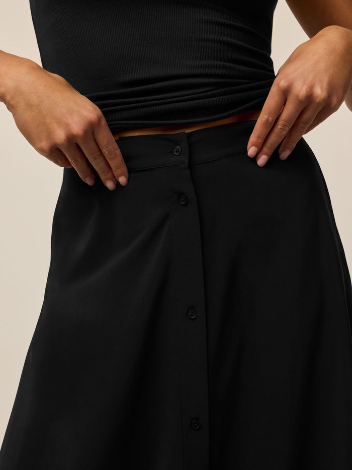 Greyson Clothiers Ashe Midi Skirt in Black - Waistband & Button Placket Close-Up | Greyson Clothiers