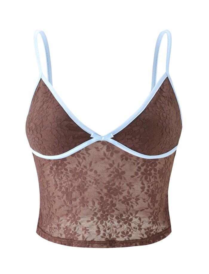 The AUBURN TOP - CHOCOLATE by TIGERMIST is a sheer brown lace cami crop top with adjustable straps, blue piping on the neckline and underbust, and a delicate floral pattern in semi-sheer lingerie fabric for a modern look.