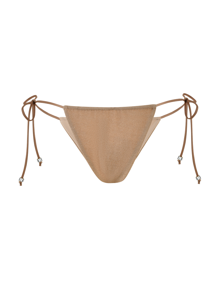 The AVE BIKINI BOTTOM - GOLD by TIGERMIST features adjustable side ties with metallic bead accents, adding subtle glamour to this gold sparkle bikini. Shown against a plain white background.