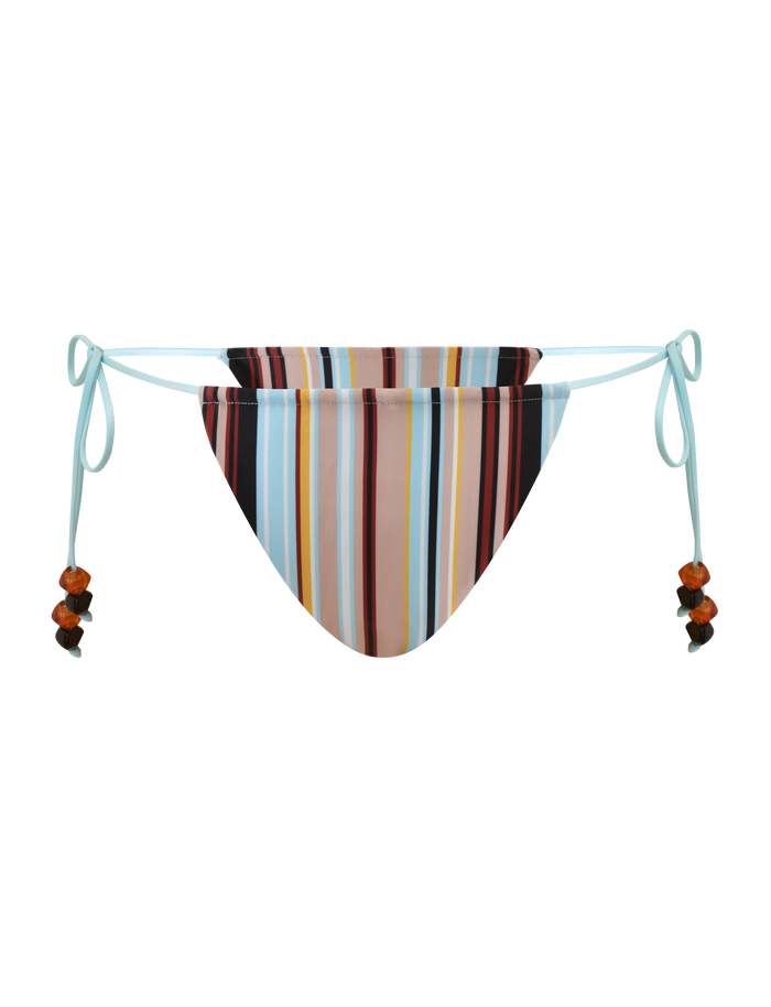 The AVE BIKINI BOTTOM - VARIEGATED STRIPE from TIGERMIST features multicolored vertical stripes and light blue adjustable side ties with orange and black beaded accents, offering playful, cheeky coverage.