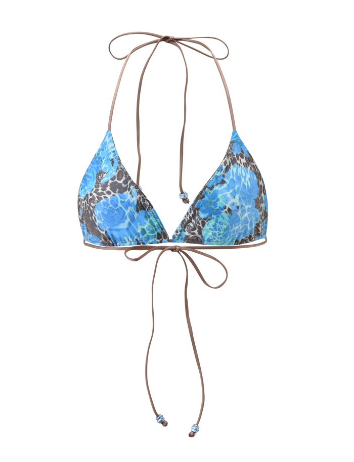 The AVE BIKINI TOP - BLUE LEOPARD by TIGERMIST features triangle cups, thin tan halter straps that tie at the neck and back, and decorative beads on the ends, blending animal print with a chic touch.