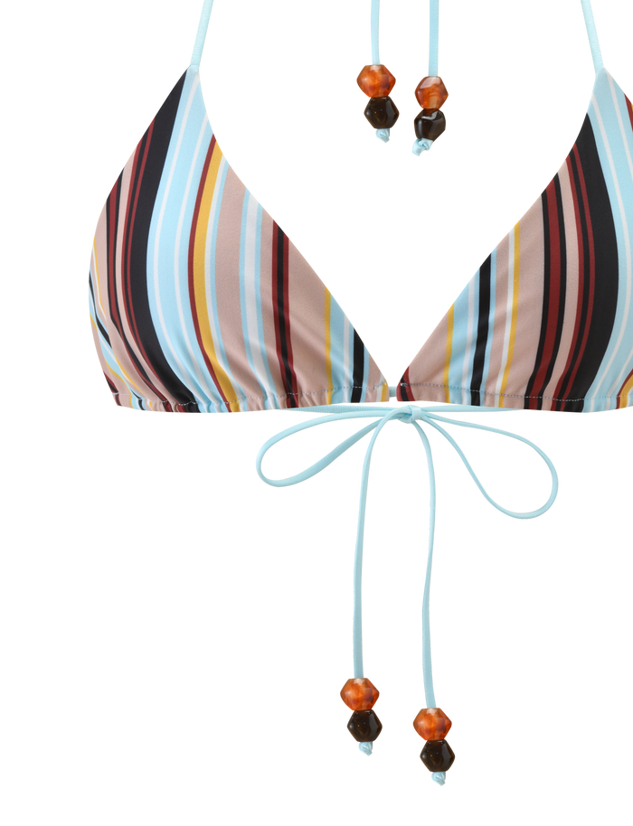 A close-up of the TIGERMIST AVE BIKINI TOP - VARIEGATED STRIPE, a triangle bikini with multicolored vertical stripes in blue, brown, yellow, and red, featuring light blue thin straps and beaded ties with orange and dark brown beads.