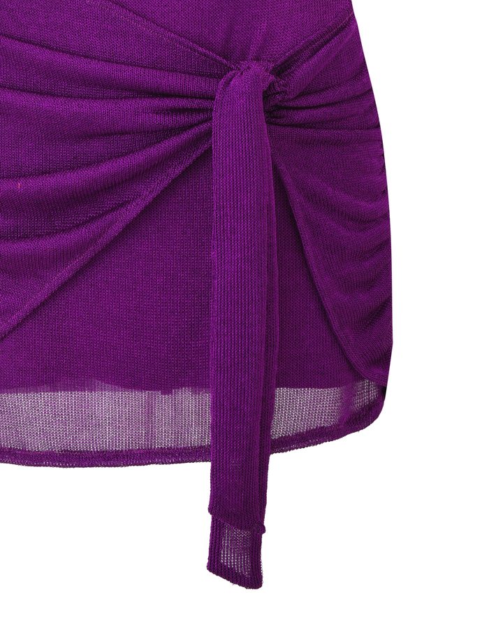 A close-up of the TIGERMIST AZELMA DRESS in purple, a ribbed mini dress with a front knot, draped detailing, and a subtly sheer lower edge.