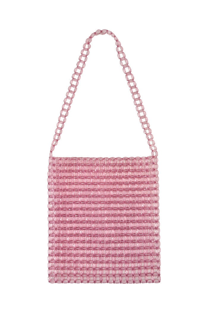 The BIANKA BAG by TIGERMIST is a medium-sized rectangular pink handbag with glossy lucite beads in a grid pattern. Its simple yet stylish design makes it an elegant accessory for any occasion.