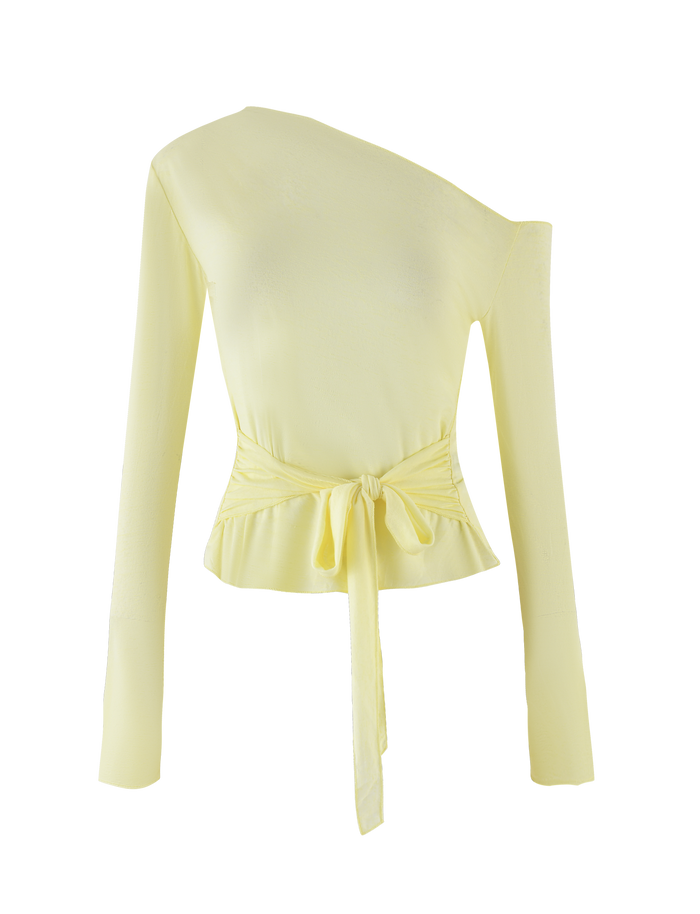 The BRYNA JUMPER by TIGERMIST in Pale Lemon is a light yellow, long-sleeve knit blouse with an asymmetrical one-shoulder neckline, waist front tie, fitted silhouette, and adjustable styling for versatile looks.