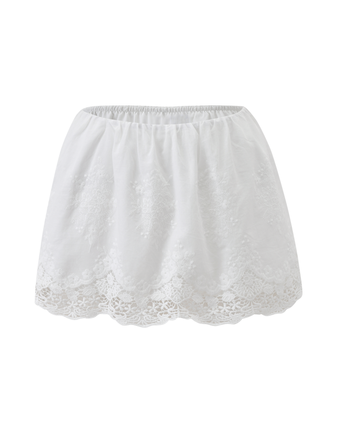 The CAILEIGH MINI SKIRT by TIGERMIST features a white A-line fit, elastic waistband, and floral lace along a scalloped hem. Its lightweight fabric creates an airy, feminine style ideal for warm days.