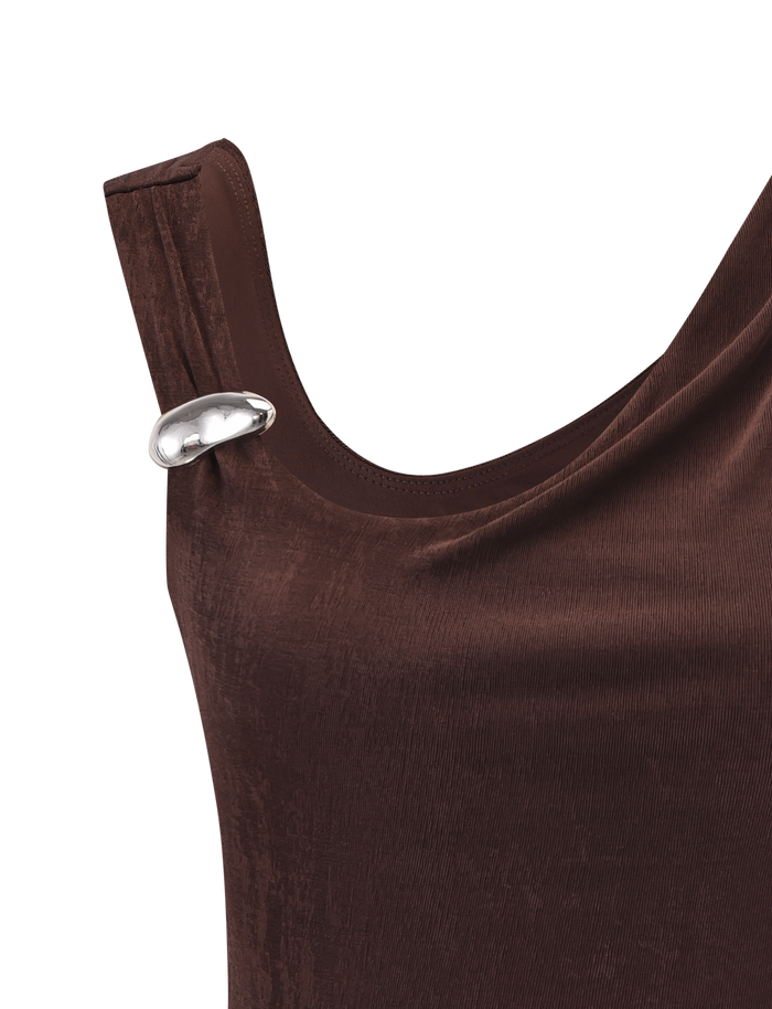 A close-up of the TIGERMIST CASSIAN TOP in chocolate velvet, highlighted by a shiny silver oval brooch at the left shoulder.