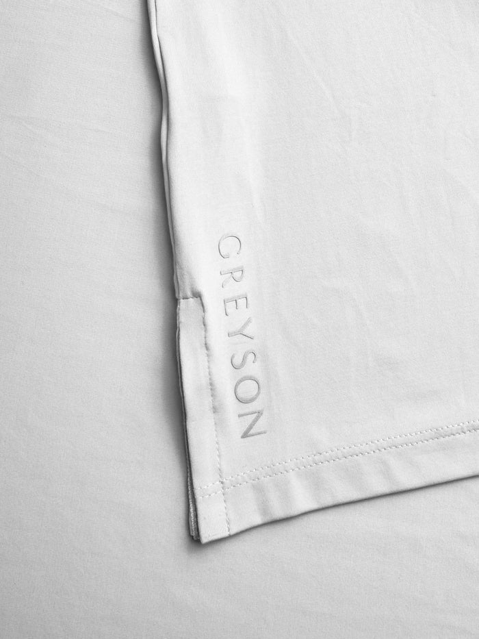 Arctic Cayuse Sport Polo - Greyson Wordmark Hem Detail | Greyson Clothiers