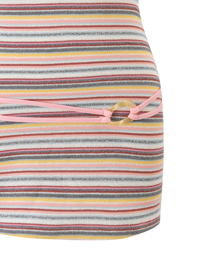 A close-up of the TIGERMIST CELESTE MINI DRESS - MULTISTRIPE, featuring ribbed fabric with gray, yellow, pink, and white stripes, a multicolored pattern, and a side cut-out tied with pink drawstrings.