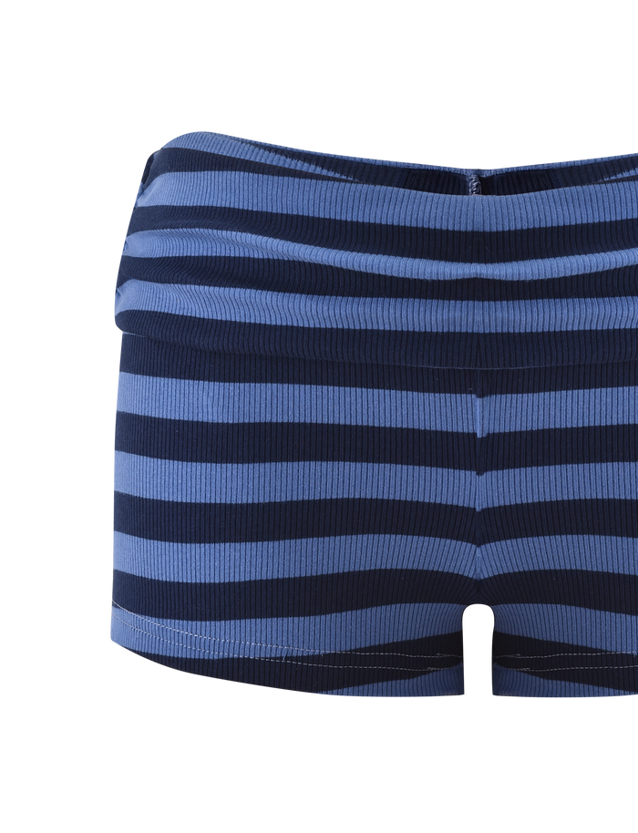 The CERYS RIB SHORT - BLUE NAVY STRIPE by TIGERMIST features blue and navy horizontal stripes, a ribbed knit, and a foldover waistband, inspired by classic blue stripe mini skirts. Shown against a white background.