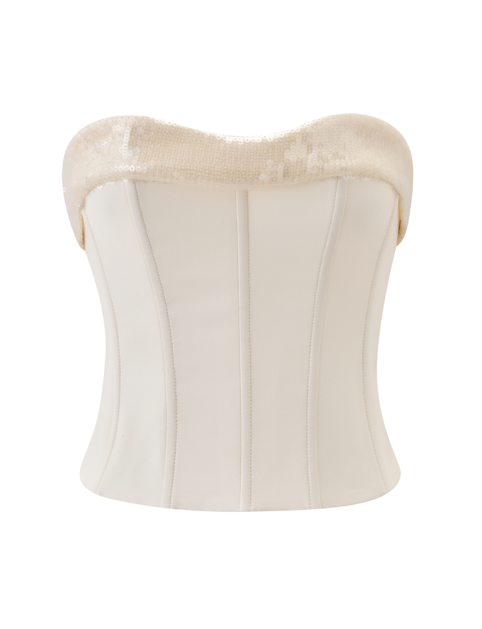 The TIGERMIST CHARLYZE BUSTIER in cream is a strapless corset top featuring vertical seams, a sweetheart neckline, and light sequin embellishments, shown on a plain white background.
