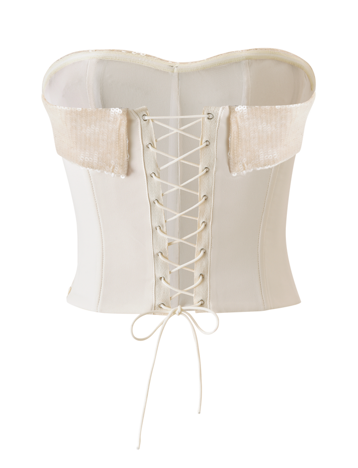 The TIGERMIST CHARLYZE BUSTIER in cream features a sweetheart neckline, sequin-embellished sides, structured boning, and a lace-up back with ribbon ties for added support and style.