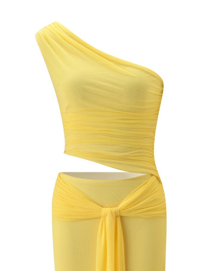 The TIGERMIST COBI 2.0 MAXI DRESS in butter yellow features a one-shoulder neckline, ruched bodice, asymmetrical waist cut-out, and draped sash detail at the hips.
