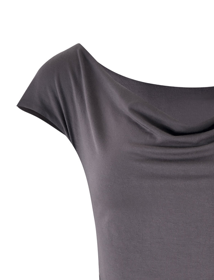 A close-up of the COBI JERSEY TANK - GREY in Steel Grey from TIGERMIST. The sleeveless top is made of a soft, draping fabric with a wide neckline that forms gentle, smooth folds, giving it a relaxed and elegant appearance. The shot focuses on the upper part of the tank, highlighting its texture and drape.