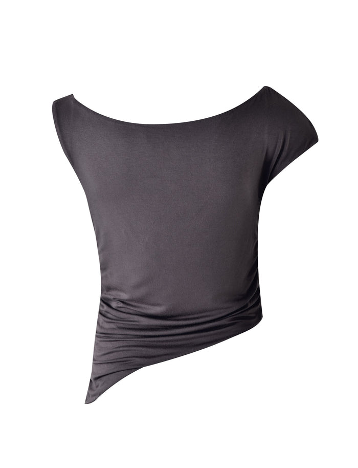 The COBI JERSEY TANK in Steel Grey from TIGERMIST is a stylish, asymmetrical, one-shoulder top featuring a diagonal hemline. The smooth fabric includes slight ruching on one side, resulting in a gathered effect. This minimalist yet elegant piece is perfect for both casual and dressy occasions.