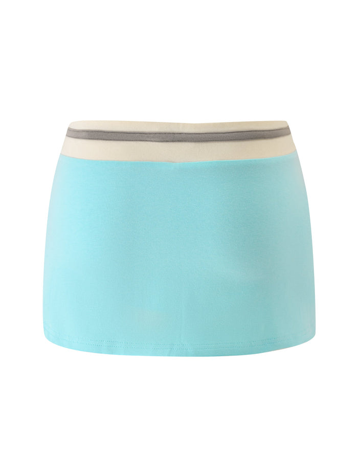 Discover the COLLINS MINI SKORT - AQUA by TIGERMIST—a stylish, light aqua blue skort featuring a wide white waistband and a thin gray stripe near the top. Designed with comfort in mind, this skort offers a simple, straight silhouette free from visible patterns or decorations, making it an effortlessly chic choice for your everyday style.