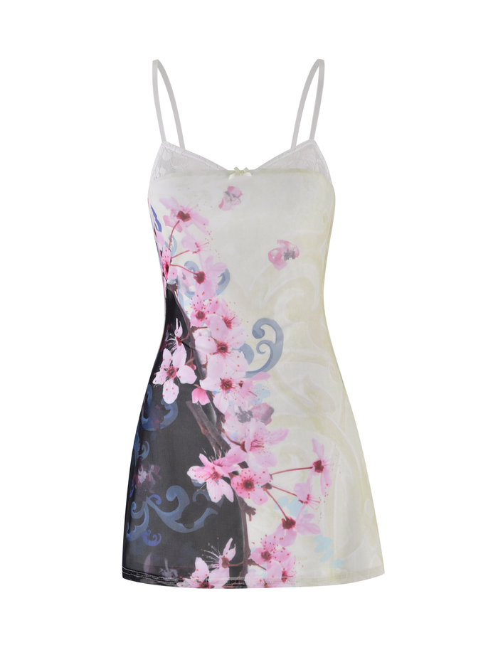 The TIGERMIST COLSON MESH MINI DRESS features thin straps, a sleeveless design, and a cherry blossom floral print with pink flowers and a black swirling pattern on one side.