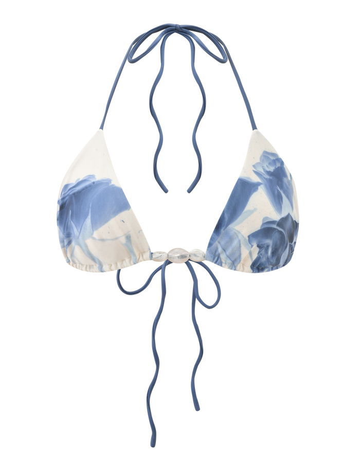The TIGERMIST CYLAS BIKINI TOP - INDIGO FLORAL is a blue and white floral halter neck bikini top with adjustable back ties, shown on a transparent background.