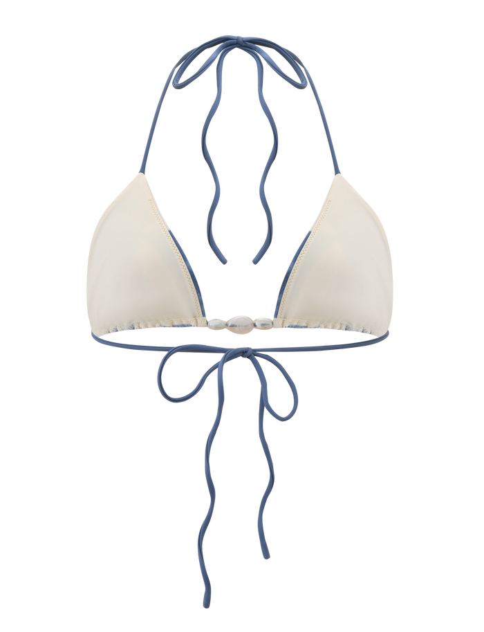 The TIGERMIST CYLAS BIKINI TOP - INDIGO FLORAL features a cream halter neck design with blue straps and trim, plus an adjustable tie-back closure for a perfect fit.