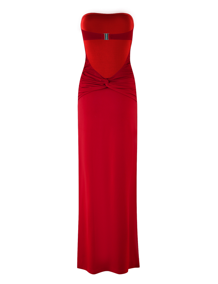 The DANIELA DRESS - RED by TIGERMIST is a strapless, maxi dress in soft jersey with a bust cutout, twisted waist knot, and decorative horizontal chest stripe.