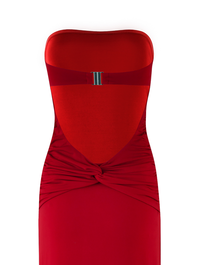 The TIGERMIST DANIELA DRESS - RED is a strapless, fitted red jersey dress with a silver clasp at the top and twisted waist knot, shown on a white background.