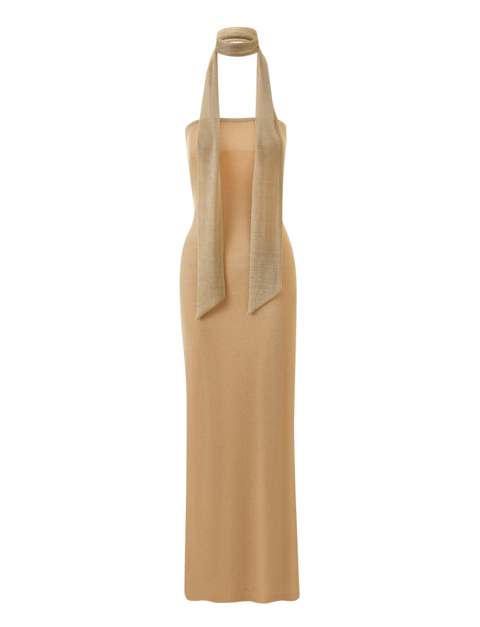 TIGERMIST’s DANIELA SCARF DRESS 2.0 - GOLD is a sleeveless, floor-length knit dress in gold with a halter neckline and open back, paired with a matching long scarf elegantly draped around the neck.