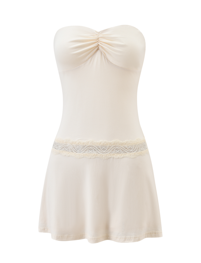 The DELARA DRESS - CREAM by TIGERMIST is a strapless mini dress with a figure-hugging fit, ruched bust, and delicate lace waist insert, shown on a white background.