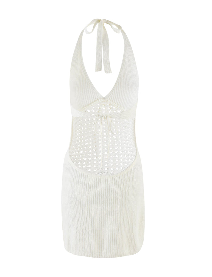 The DELTA MINI DRESS - WHITE by TIGERMIST is a white knit halter mini dress with an open midriff, tie-back straps, waist cutout, and ribbed crochet detailing on the skirt and bust.