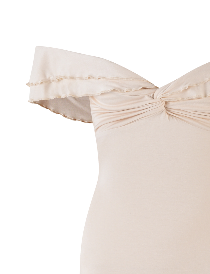 The DENALI MINI DRESS - WHITE : BONE by TIGERMIST is an off-the-shoulder, light beige mini dress with a ruffled neckline, twisted knot at the bust, and a flattering A-line silhouette.