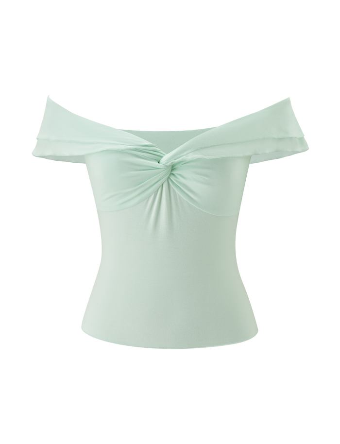 The DENALI TOP - SOFT MINT by TIGERMIST is an off-shoulder, mint green top with a twisted center knot, draped neckline, and fitted silhouette. Made from smooth modal fabric for a subtle sheen.
