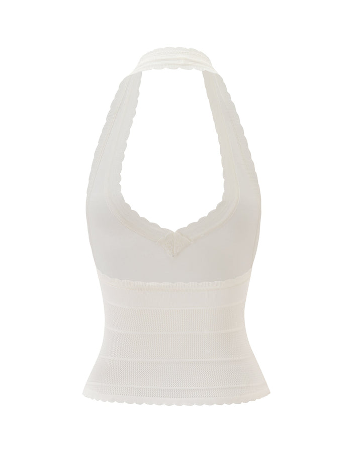 The DENI HALTER - CREAM by TIGERMIST is a white knit halter top, featuring a plunging V neckline, scalloped edging, and a fitted ribbed texture on the lower half, shown against a plain white background.