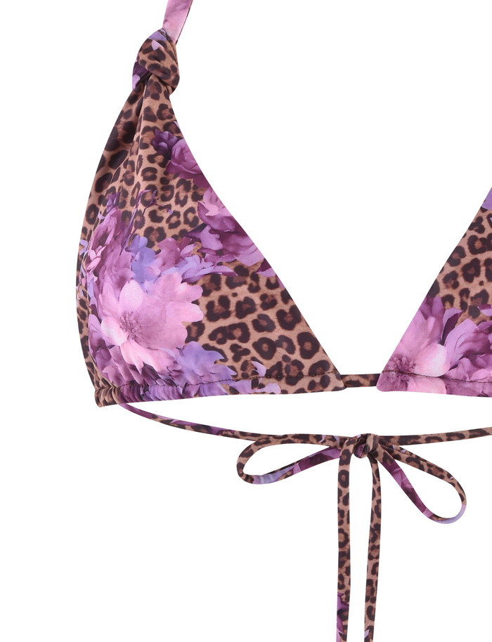 A close-up of the TIGERMIST DESIRAE BIKINI TOP in purple floral leopard print, featuring halter straps, adjustable cups, and a front tie detail.