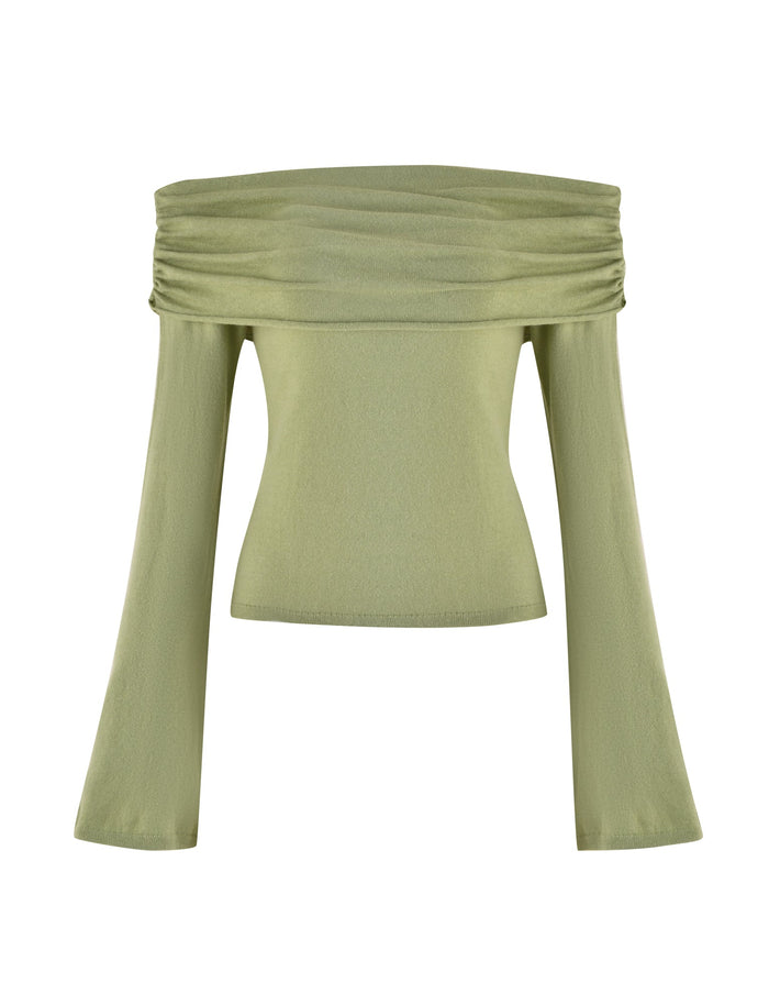 The DIEDRE JUMPER - GREEN by TIGERMIST is an off-the-shoulder, long-sleeve top that comes in a light green hue. This fitted semi-sheer knit features a ruched neckline and a fitted bodice with slightly flared sleeves. The fabric provides a smooth, silky appearance, ensuring both style and comfort.