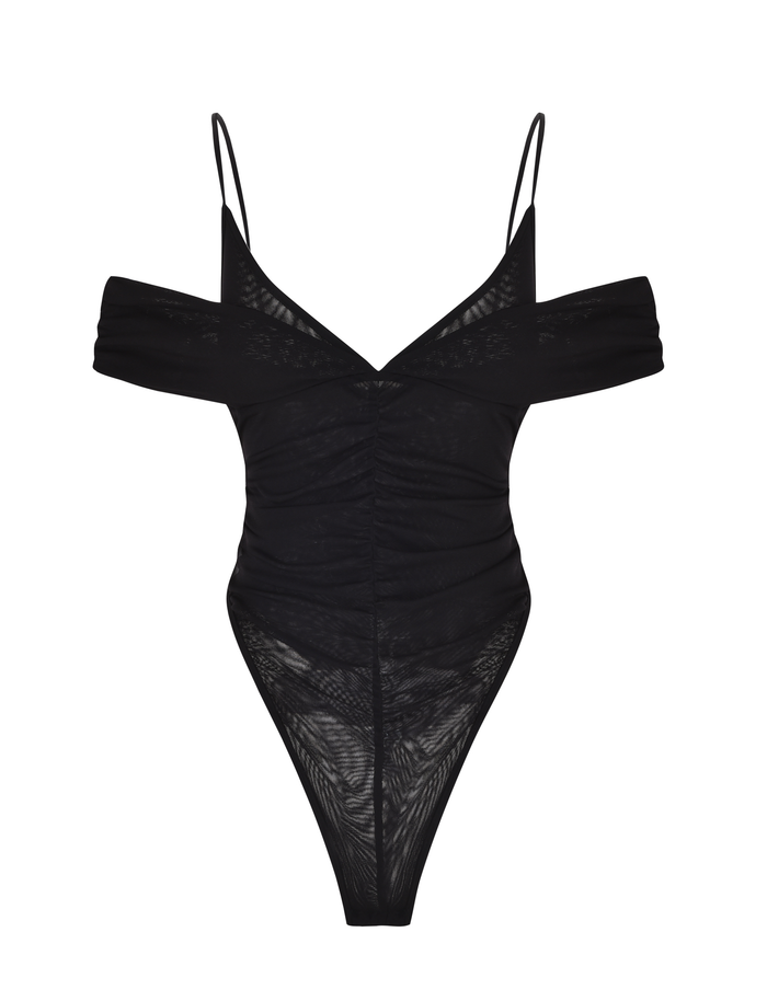 The DRAYA BODYSUIT by TIGERMIST is a black mesh, semi-sheer bodysuit with off-shoulder sleeves, thin spaghetti straps, and a ruched bust, shown against a white background.