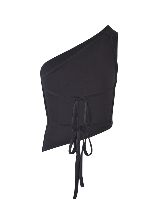 The DREW TOP - BLACK by TIGERMIST features a one-shoulder design, asymmetric neckline, front wrap-around tie detail, and bodycon fit, shown against a plain white background.