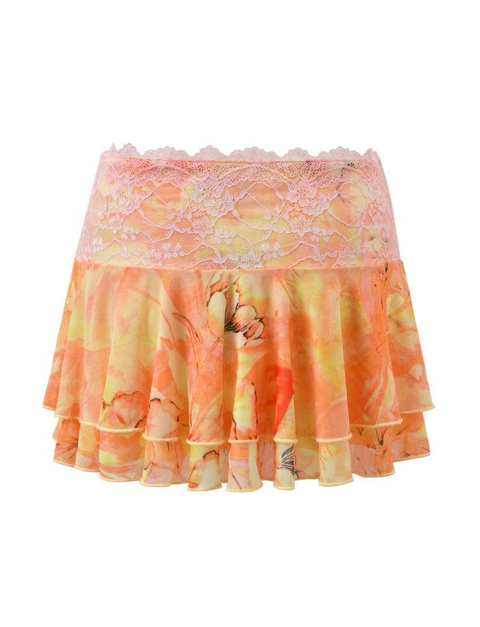 The DUNE MESH SKIRT - CREAMSICLE by TIGERMIST is a mini skirt with tiered ruffles, a pink lace waistband, and a vibrant orange-yellow watercolor floral pattern on layered, flowy fabric for a playful look.