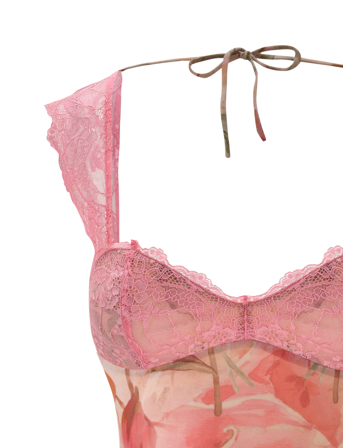 A close-up of the TIGERMIST DUNE TOP - WATERCOLOUR FLORAL shows sheer pink floral lace cups, adjustable lace straps, and a thin ribbon tie at the neck, all set against a white background.
