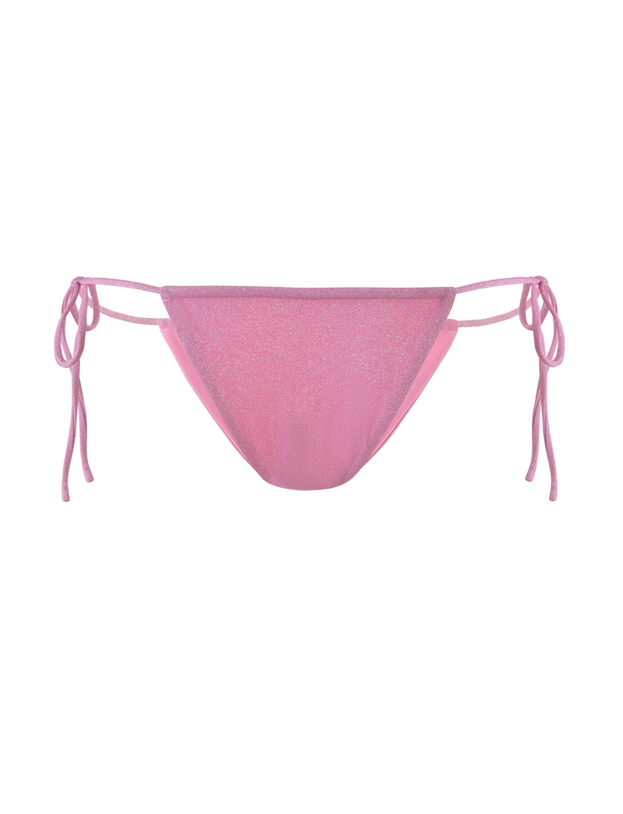 The TIGERMIST ELLISON BIKINI BOTTOM in baby pink features shimmer fabric, a low-rise waist, and adjustable side ties, shown against a plain background.