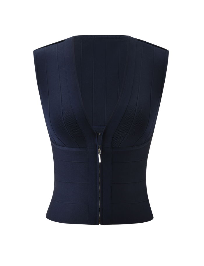 The TIGERMIST EMBER BANDAGE TOP in navy blue is a sleeveless tank with a deep V-neck, front zipper closure, and sculpted fit. Subtle vertical seams enhance its sleek look. Shown on a plain white background.